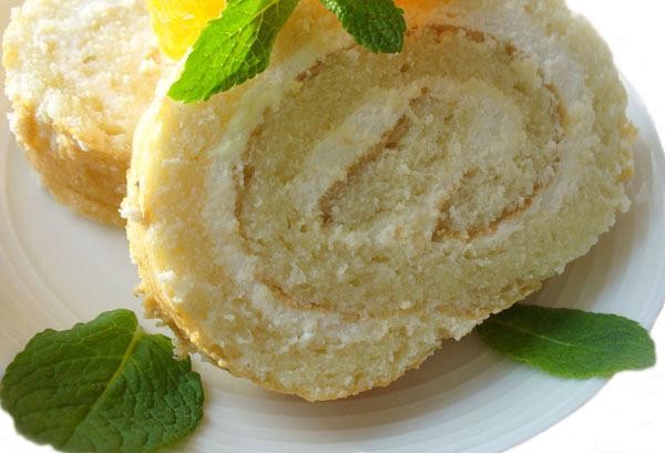 Pineapple sponge cake roll with whipped cream ( Greek whipped cream kormos )